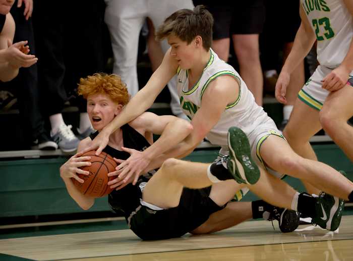 Every loose ball was highly contested. Photo: Dennis Lee
